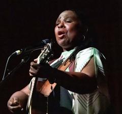 Ruthie Foster performing at the LBJ Presidential Library during Civil Rights Act 60th Anniversary event with President Joe Biden in attendance