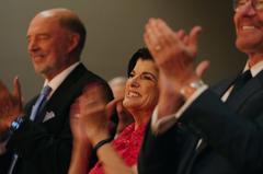 Luci Baines Johnson applauding President Biden at LBJ Presidential Library event