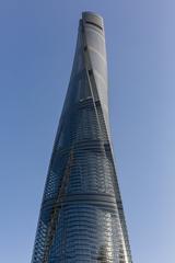 Shanghai Tower viewed from below showing its spiraling design against a clear sky