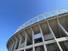 Ernst Happel Stadium in Vienna with blue seating and a clear sky in June 2022