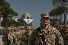 Florida Army National Guard Soldiers saluting during Immediate Response 21 military ceremony in Tirana Albania May 2021