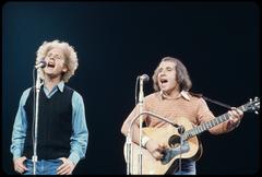 Simon and Garfunkel performing live at Madison Square Garden during the 'Together for McGovern' concert in June 1972