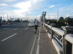 Mabini Bridge and A. Lacson Avenue-Mabini Bridge Fly-Over over Pasig River in Manila with city buildings in the background
