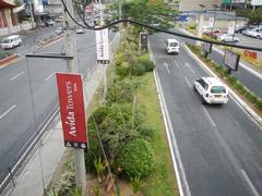 North Avenue in Quezon City with busy traffic and urban buildings
