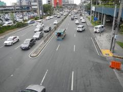 North Avenue in Quezon City approaching EDSA interchange with SM City North EDSA mall visible