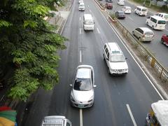 View of North Avenue and EDSA intersection with SMB City North EDSA mall and surrounding buildings in Quezon City