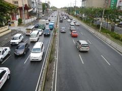 North Avenue and EDSA highway interchange in Quezon City with SM West mall and busy urban surroundings