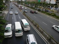 North Avenue and EDSA interchange near SM City North EDSA in Quezon City with heavy traffic and high-rise buildings