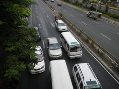 View of North Avenue in Quezon City with cars and buildings including SM City North EDSA mall near EDSA interchange