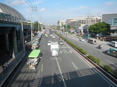 North Avenue interchange with EDSA road in Quezon City with traffic and tall buildings
