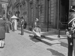 Widow of Pakistani prince standing near Palace Lange Voorhout in black and white photo
