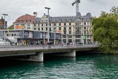 Bahnhofbruecke bridge in Zurich with trams and historic buildings on a cloudy day
