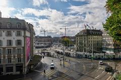 Bahnhofbrücke bridge in Zürich over the Limmat river with boats and cityscape