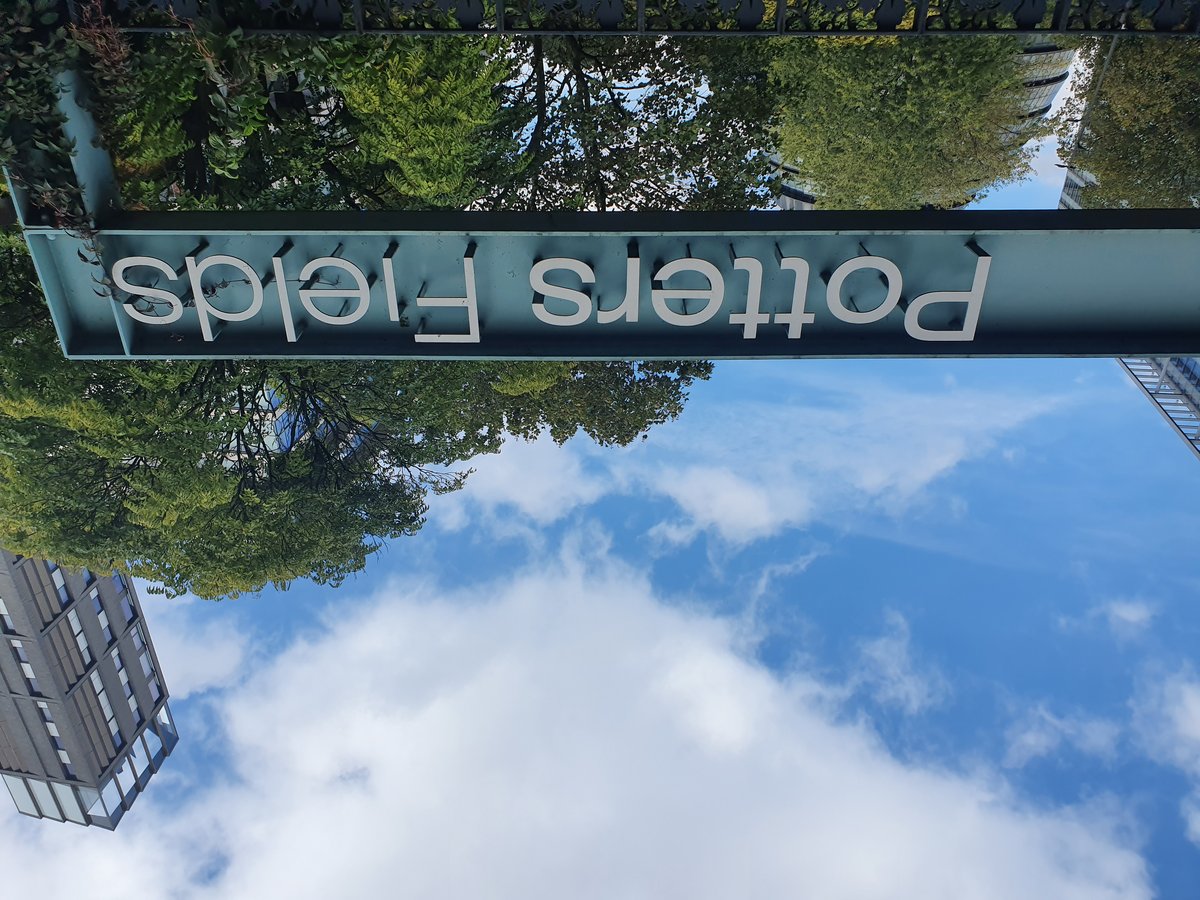 Potters Fields Park sign in London with blue sky background