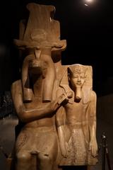 Close-up view of ancient Egyptian inscriptions and hieroglyphs on carved stone