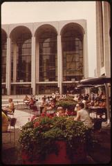 Aerial view of Lincoln Center Plaza surrounded by two theaters, an opera house and a concert hall with adjacent streets