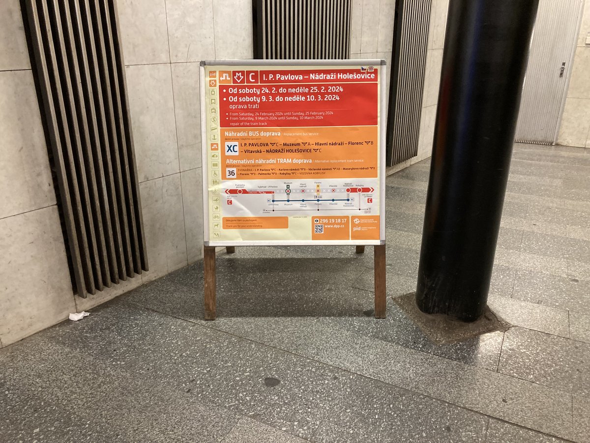 I. P. Pavlova metro station platform with blue and white tiled walls and signage
