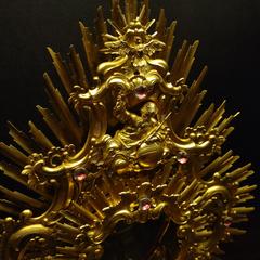 Rococo monstrance with sun rays and dark red glass imitation gems resembling Bohemian garnet