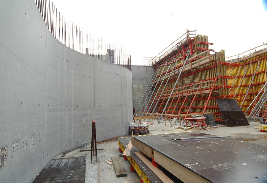 Roberto Galasso at DARC construction site with heavy machinery and scaffolding