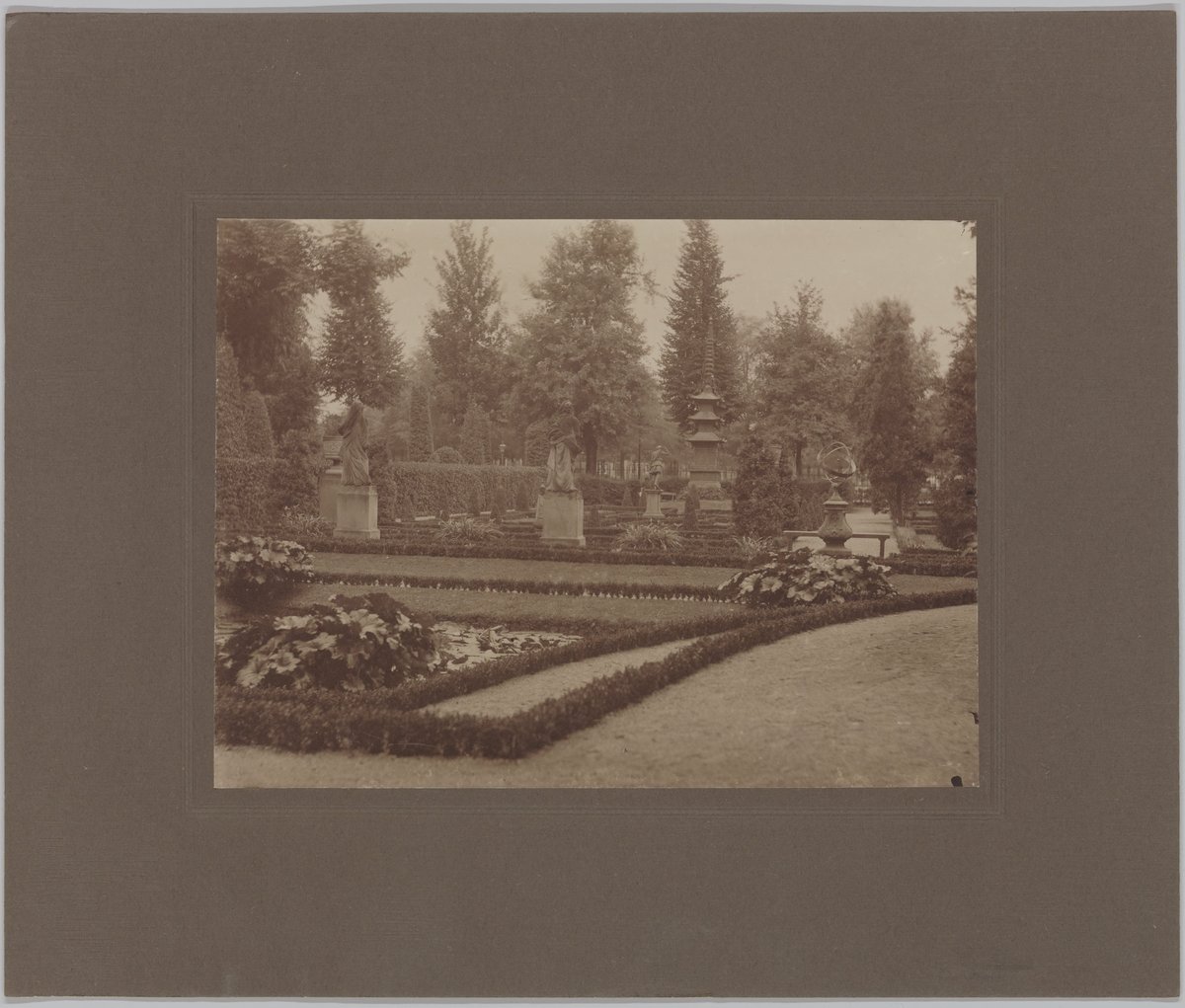 French garden with pond, statues, sundial, and pagoda between Villa and Museum street