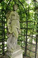 statue of a woman in a garden