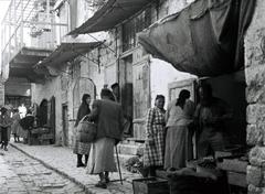 Street scene in Safed with historic buildings and street lamps