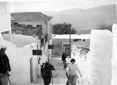 Safed street watcher hanging fishnets on a wall