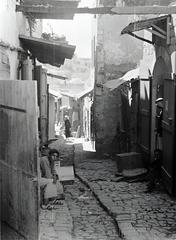 Narrow alleys in Safed with old stone buildings and vibrant blue doors
