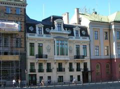 Sager Palace in Stockholm with green trees and clear blue sky