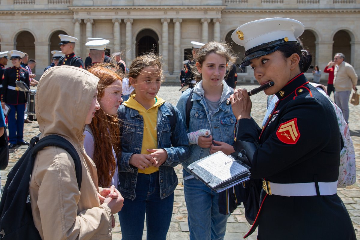 U.S. Marine Corps Cpl. Angela Guerrero playing piccolo for school children at Les Invalides in Paris in 2022