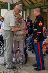 U.S. Marine Corps trombone instrumentalist meeting veteran after Les Invalides performance