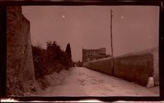 View down the ancient Appian Way towards the Tomb of Caecilia Metella in Rome