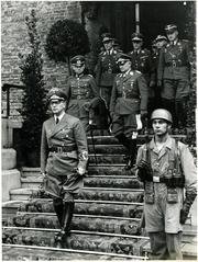 Reich Minister Dr. Arthur Seyss-Inquart, Lieutenant General Alexander von Falkenhausen, and General Friedrich Christiansen leaving the Hall of Knights at the Binnenhof in 1940