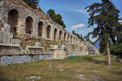 The Stoa of Eumenes ancient ruins with stone columns and ruins under a bright blue sky