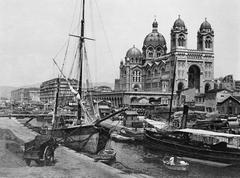 Ancient canal connecting the old port and Joliette port in Marseille with cathedral in the background