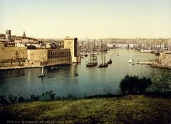 Entrance to the Vieux-Port harbor in Marseille, France around 1900, featuring Fort Saint Jean on the left