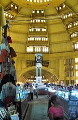 Interior view of Central Market with bustling crowd and architectural details