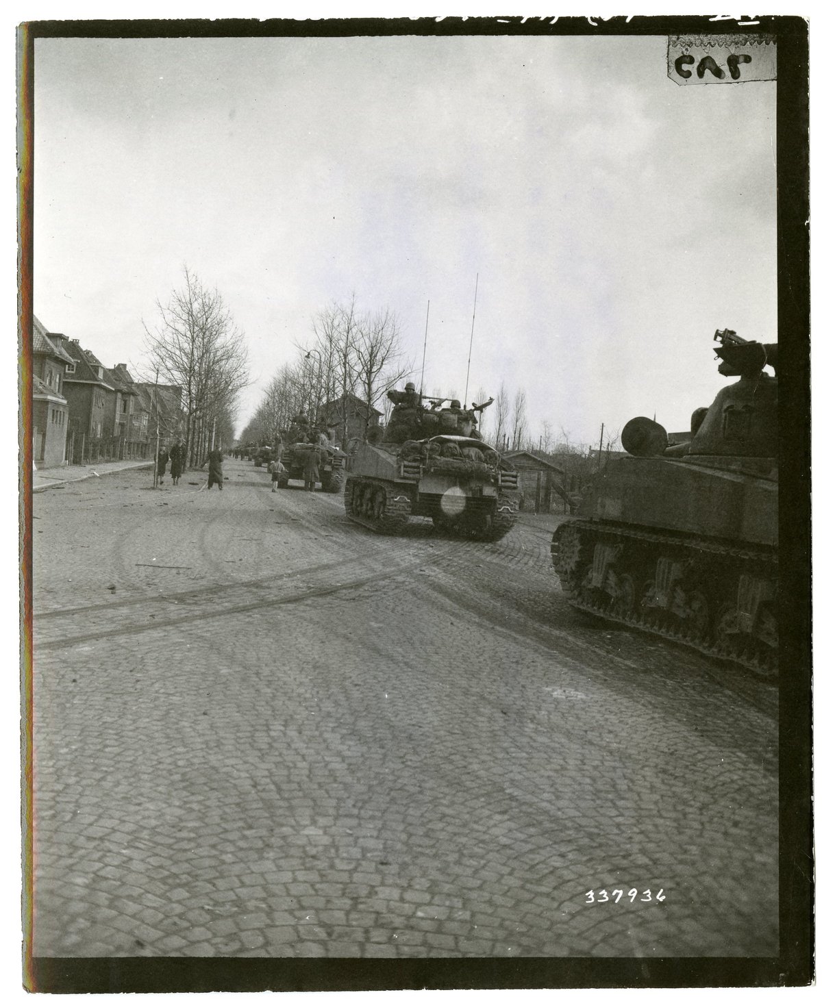 784th Tank Battalion tanks of the 35th Infantry Division advancing from Venlo, Holland towards Germany during WWII