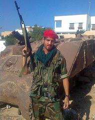 Jose Emmanuel Piaggesi holding a rifle in Libya
