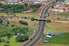 Highway junction on BR-369 with multiple lanes and green trees