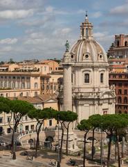 Colonna Traiana and Santissimo Nome di Maria church dome in Rome Italy