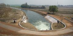 Sasan Canal originating point at Hirakud Dam with water flowing and surrounding landscape