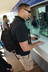 Lance Cpl. Aaron Kristopik presenting military ID card at SeaWorld San Diego