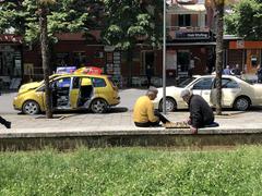Two men playing chess in central Tirana
