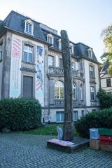Exterior view of Weltkulturen Museum with modern architecture and glass entrance