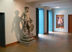 Entrance area of Museum zu Allerheiligen in Schaffhausen with modern glass doors and stone steps