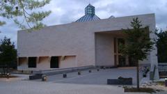 View of Musee d'Art Moderne modern art museum building with blue sky