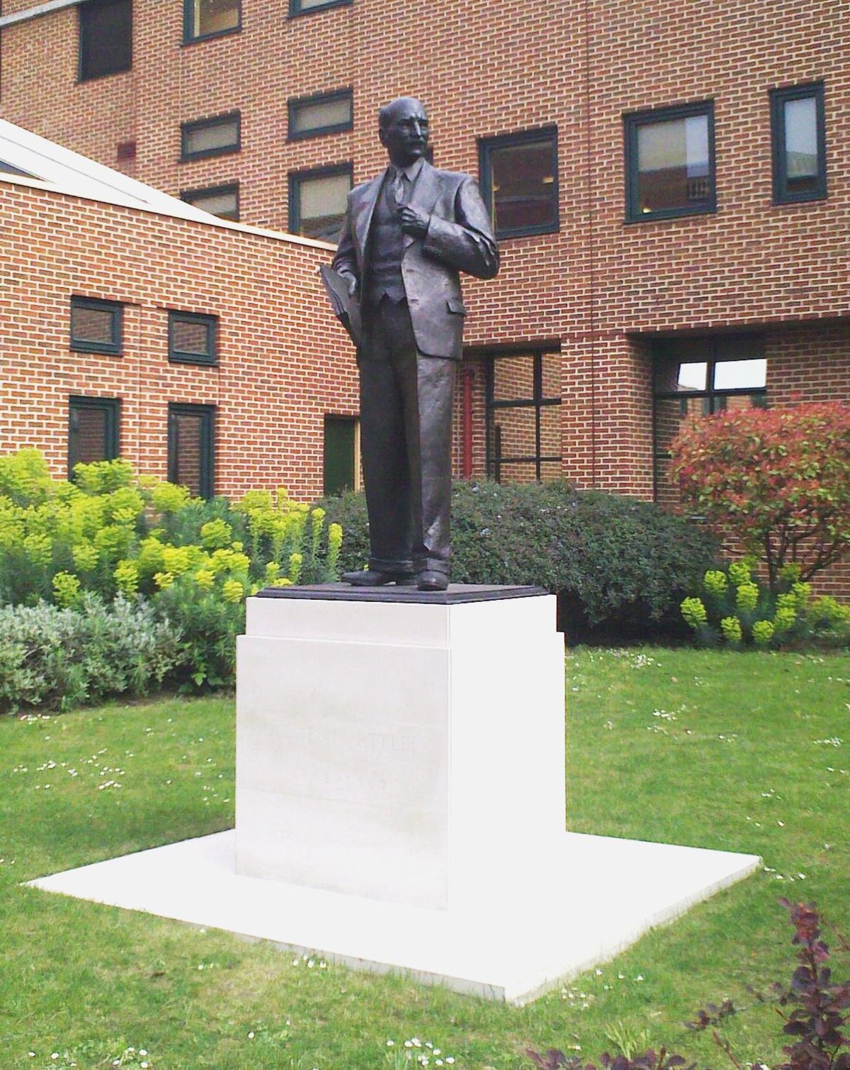 Statue of Clement Attlee outside Queen Mary University Library at Mile End after restoration