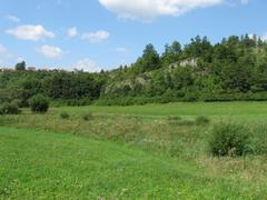 Krasovské údolí valley with the sinking stream of Krasovský potok behind Balcarka house