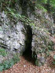 Interior view of Nad Svýcarnou cave showcasing rock formations